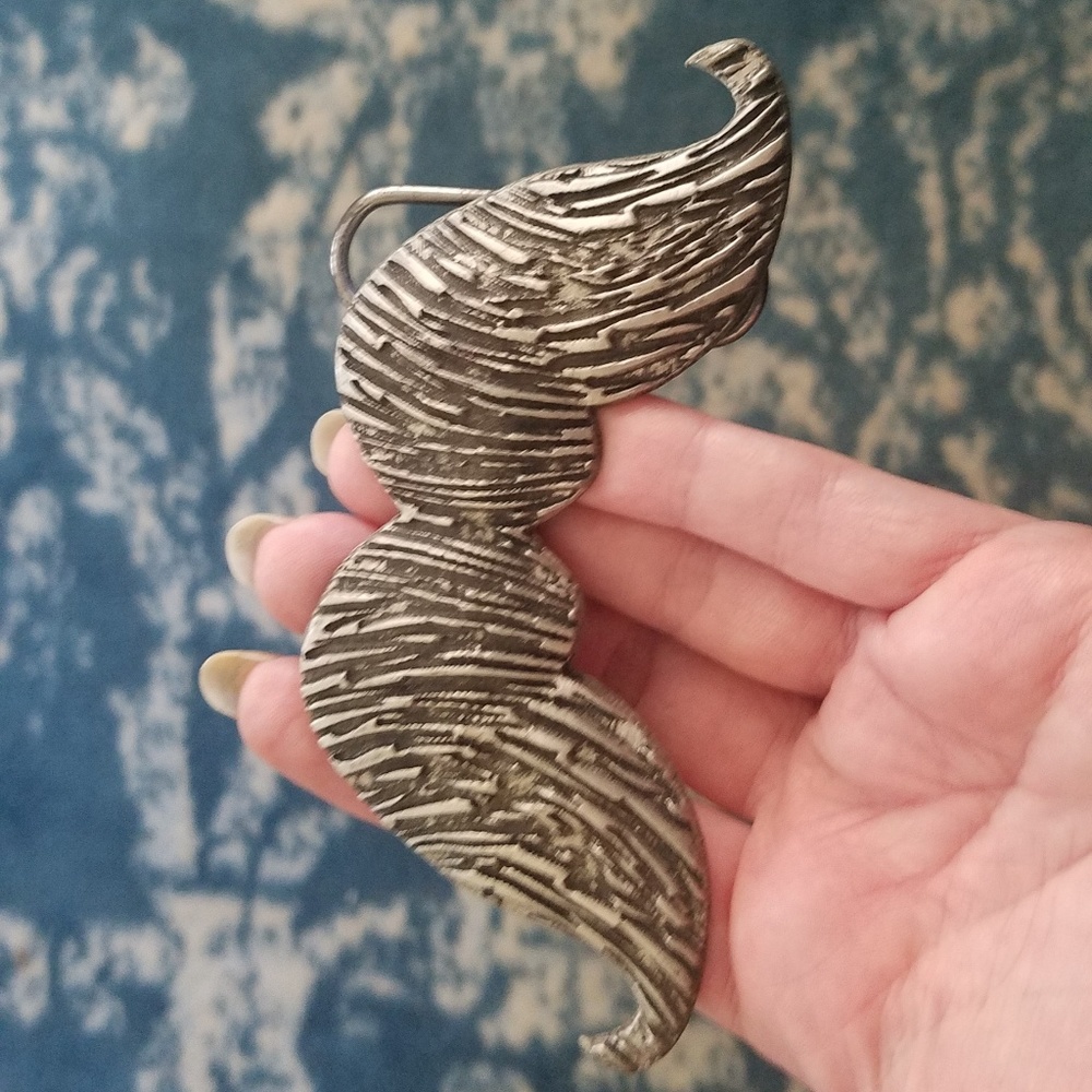 Mustache belt buckle